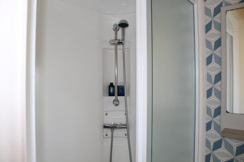 a shower stall in a bathroom with a mirror at Clearsands at Haven in Mablethorpe