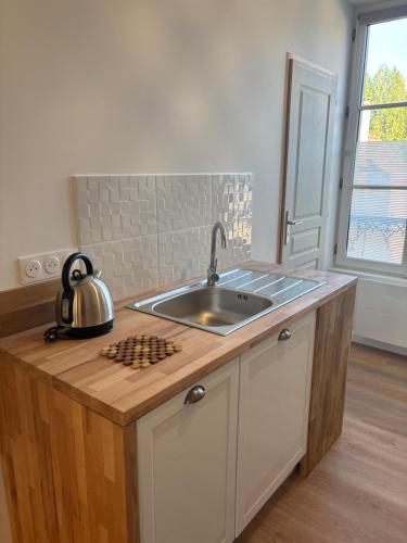 Køkken eller tekøkken på Résidence ARTHUS Ménalippe