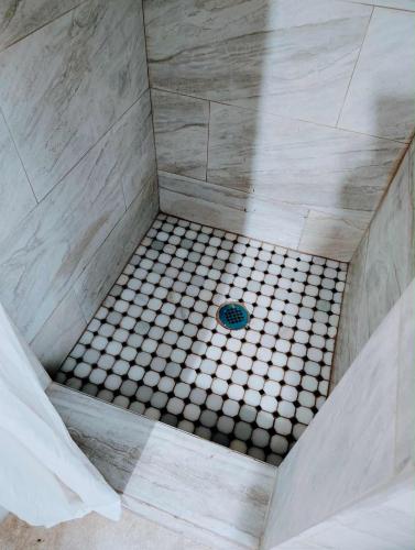 an overhead view of a shower with a tiled floor at Beach Side Hotel in Myrtle Beach