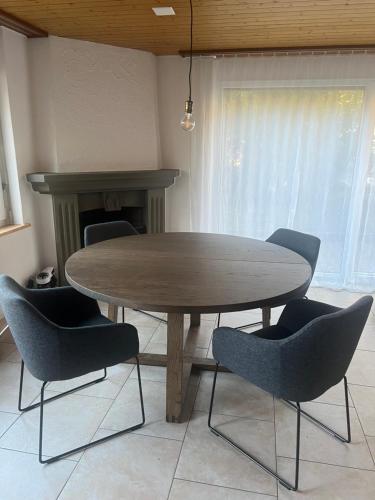 a table and chairs in a room with a table and a table and a table at Rückzugsort in Reichenbach