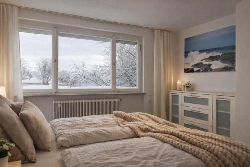 Un pat sau paturi într-o cameră la Haus am Bodensee