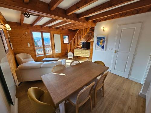 a living room with a wooden table and chairs at Chalet Cosy à Bolquère in Bolquere Pyrenees 2000