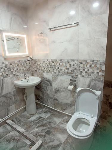 a bathroom with a toilet and a sink at Green Paradise in Ijevan