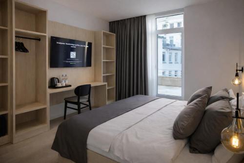 Katil atau katil-katil dalam bilik di Niko Hotel am Hannover Hbf