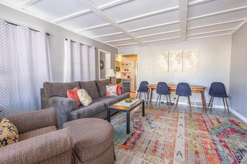 a living room with a couch and a table at Rustic 2 Bedroom Boho Apartment in Laramie