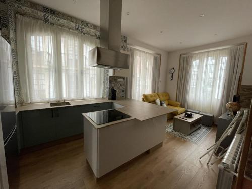a kitchen with a sink and a counter top at El Arca de Noé in Luarca