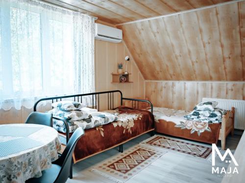 Giường trong phòng chung tại Noclegi MAJA