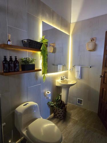 a bathroom with a toilet and a sink at Casa Marina Hotel Boutique in Ríohacha