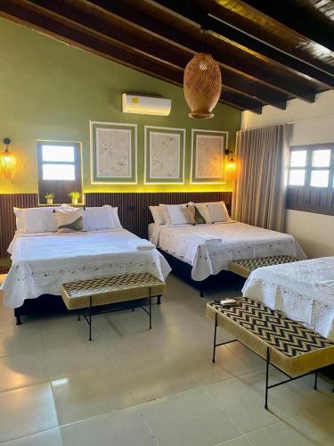 a bedroom with two beds in a room at Casa Marina Hotel Boutique in Ríohacha