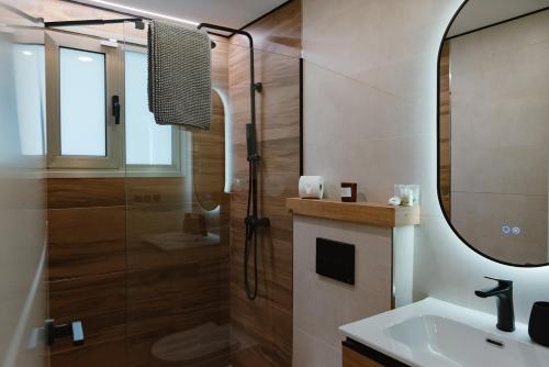 a bathroom with a shower and a sink at Seba Deluxe Home in Puerto de Santiago