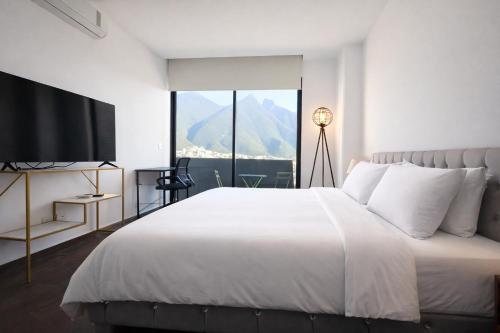 En eller flere senge i et værelse på Moderno Ubicacion Vistas Seguridad y Estilo