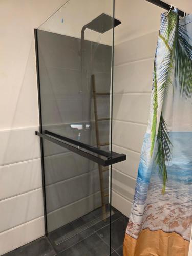 a glass shelving unit in a room with a bed at Ana i Marko in Vodice
