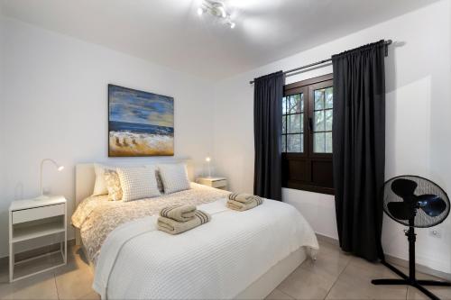 Giường trong phòng chung tại E6 Las Tabaibas