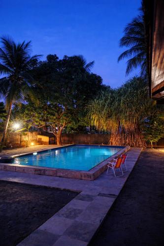 Swimmingpoolen hos eller tæt på Maison Tropical