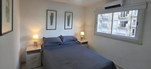 a bedroom with a bed and a window at EdenMDQ-4 in Mar del Plata