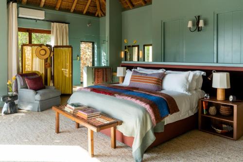 En eller flere senge i et værelse på Tamodi Estate