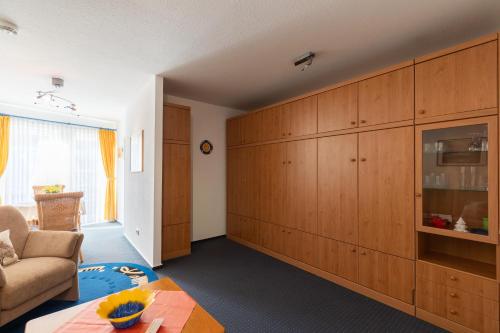a living room with a couch and a table at Haus Elbe 1, Whg 11 in Duhnen