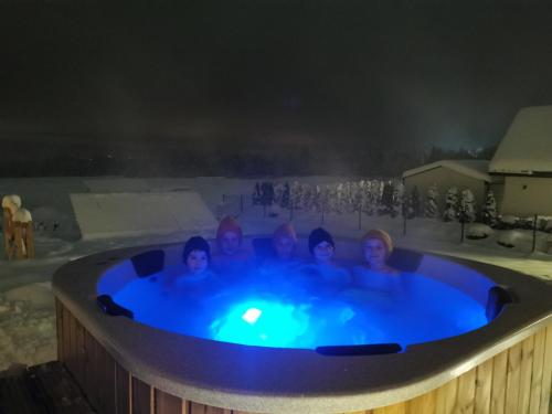 a group of girls in a hot tub at night at Kącik Na Dolinie in Groń