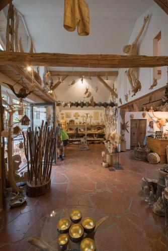 a room filled with lots of antiques on display at Atelier Garni Astei in Grossarl