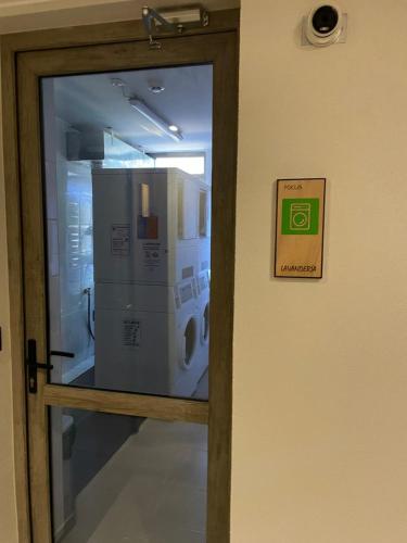 a door with a sign on it next to a window at Apartamento Pucón in Pucón