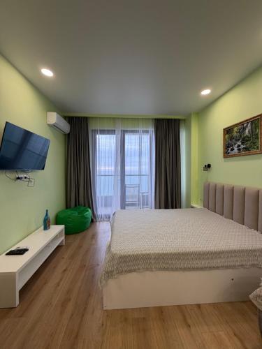 Giường trong phòng chung tại Bamboo Beach Tsikhisdziri