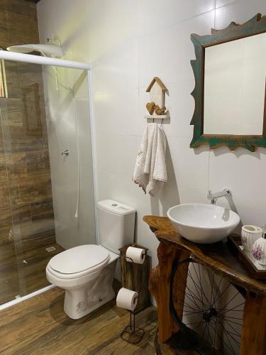 a bathroom with a toilet and a sink at Ebenezer in Benedito Novo