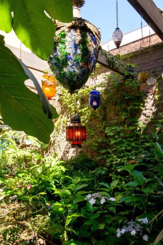 a group of colorful lights hanging from a tree at Hotel Diamonds and Pearls in Antwerp
