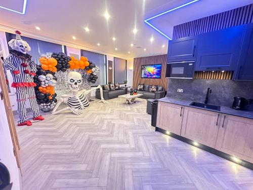a living room with a skeleton on the floor at Eleanor Rigby apts Stanley Street in Liverpool