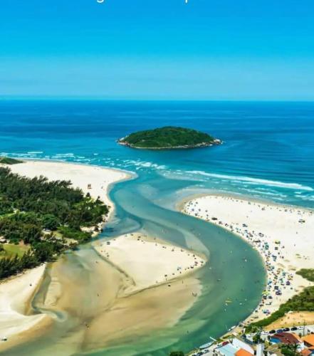 an aerial view of the beach and ocean at Loft e casa Catarina in Imbituba