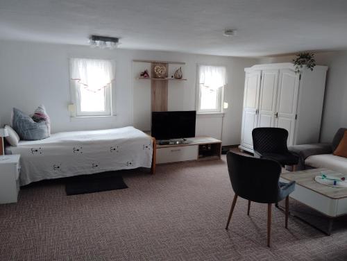 En eller flere senge i et værelse på Ferienhaus Schlenker