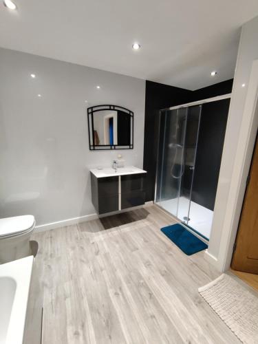 a bathroom with a sink and a mirror at Durham Norwood detached Bungalow in Trimdon Grange