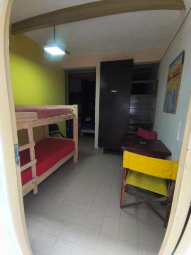 a room with two bunk beds and a desk at Departamento PB 1 Centro Pileta in Formosa