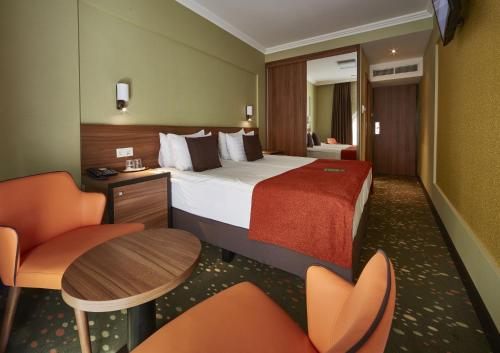 Posteľ alebo postele v izbe v ubytovaní Budget Hotel Victoria