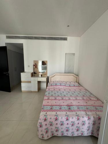 Llit o llits en una habitació de Al Mouj