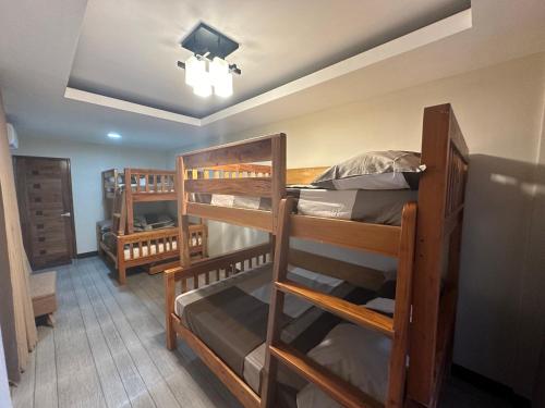 a room with three bunk beds in a room at Casa Rubio private Resort in Los Baños