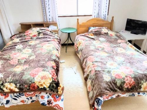 En eller flere senge i et værelse på Futami Terrace B