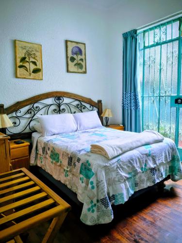 Llit o llits en una habitació de La Casona Azul