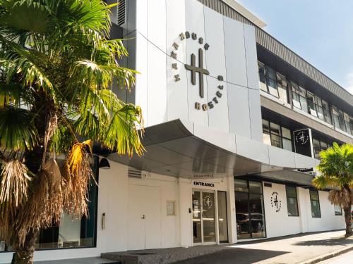 a building with a sign on the front of it at Haka House Auckland City in Auckland