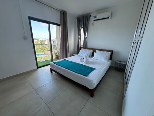 En eller flere senge i et værelse på Green Village Duplex