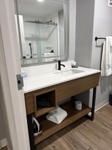 a bathroom with a sink and a mirror at Hotel Kiva, an Ascend Collection Hotel in Albuquerque