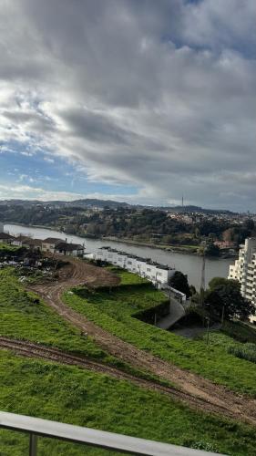 a view of a river with buildings and a city at Casa DOURO-PORTO in Valbom