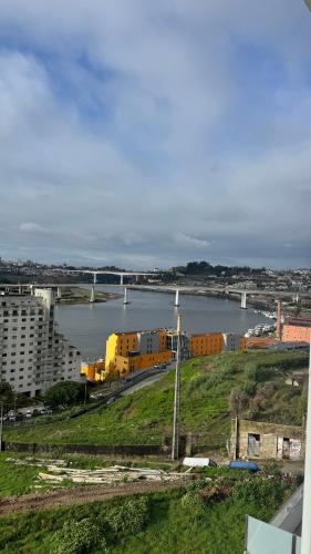 a view of a river with buildings and a city at Casa DOURO-PORTO in Valbom