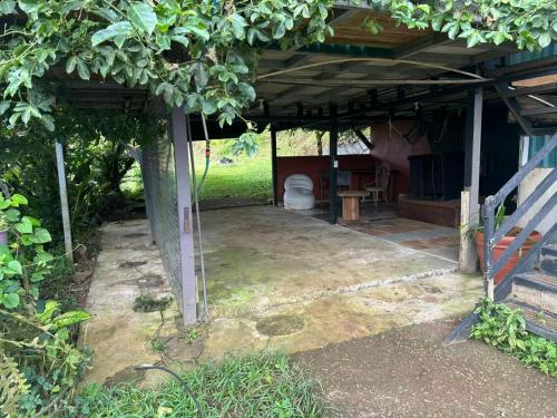an outside view of a house with a patio at El Spot Orgánico in Quesada