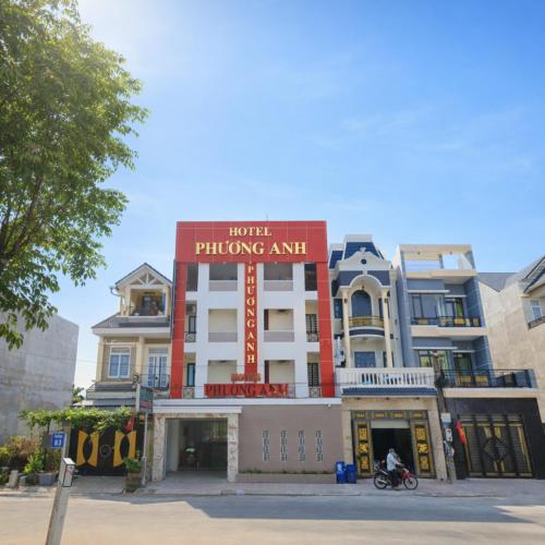 a building with a sign on the top of it at Phương Anh Hotel Dĩ An in Dĩ An