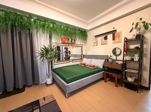 Giường trong phòng chung tại Casa Tagpuan at Manhattan Heights