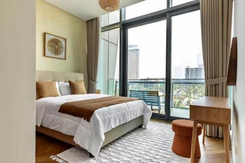 a bedroom with a bed and a large window at Private Room in Luxurious 3BR Apartment with BURJ KHALIFA view in Downtown near Dubai Mall in Dubai
