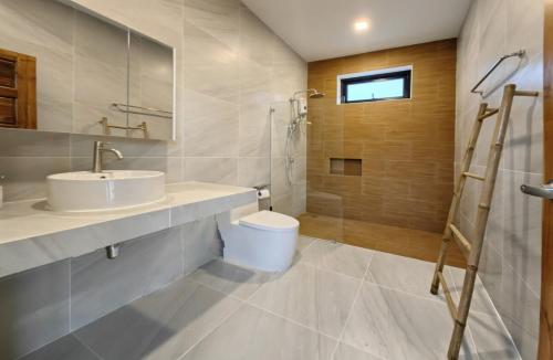 a bathroom with a sink and a shower and a toilet at Tropical Luxury Samui Villa Donava in Nathon Bay