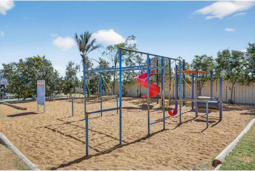 a playground with a slide in the sand at Discovery Parks - Carnarvon in Carnarvon