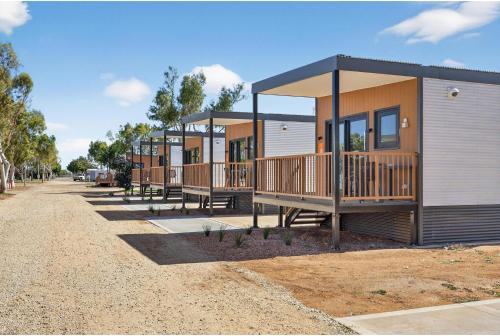 a row of modular homes on a dirt road at Discovery Parks - Carnarvon in Carnarvon