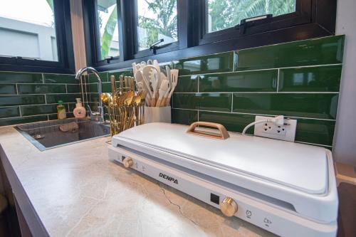 a suitcase sitting on a counter in a room at Baan Rot Fai Krabi Platform 2 in Ao Nam Mao